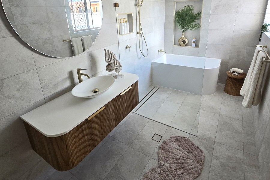 This Gold Coast bathroom renovation by Armrock included a plumbing relocation and merging two rooms.