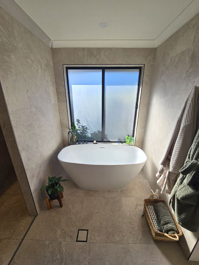 Updated freestanding bathtub post-renovation