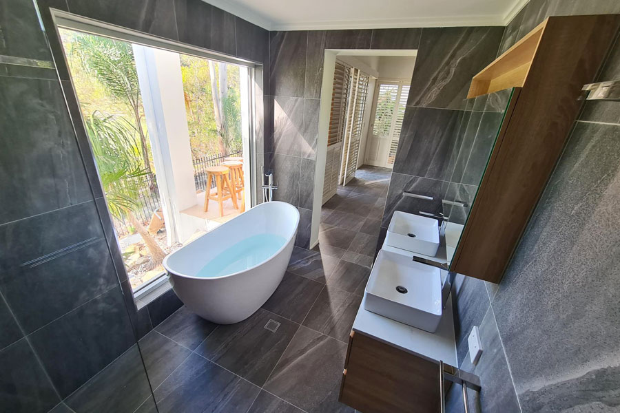 Luxury Gold Coast bathroom renovation by Armrock Constructions, featuring bathtub with a view
