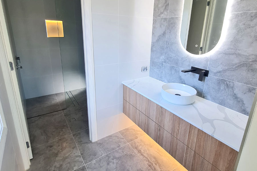 Small bathroom renovation featuring LED lighting