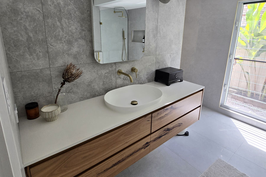 A minimal white laminate bathroom benchtop solution for this Gold Coast renovation project